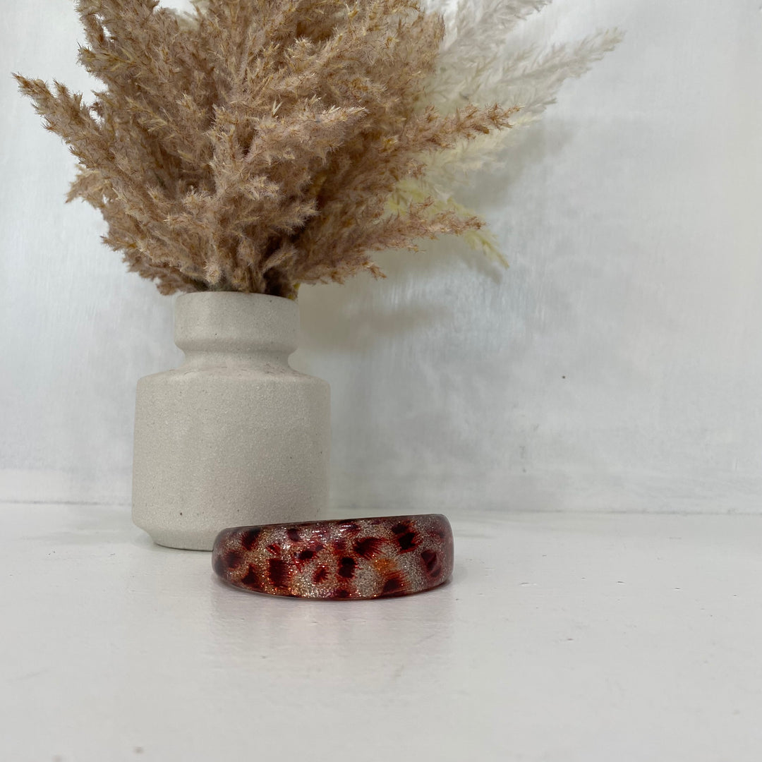 Bracelet à imprimé animalier rouge et argenté