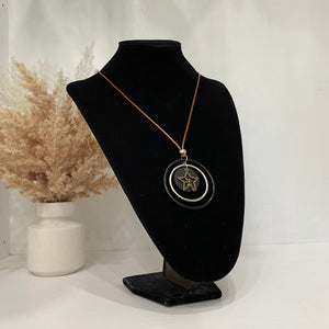 Coral Coloured Necklace With Multiple Circles And A Gold Star
