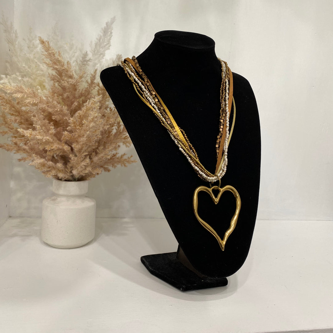 Multiple Layered Necklace With A Gold Heart