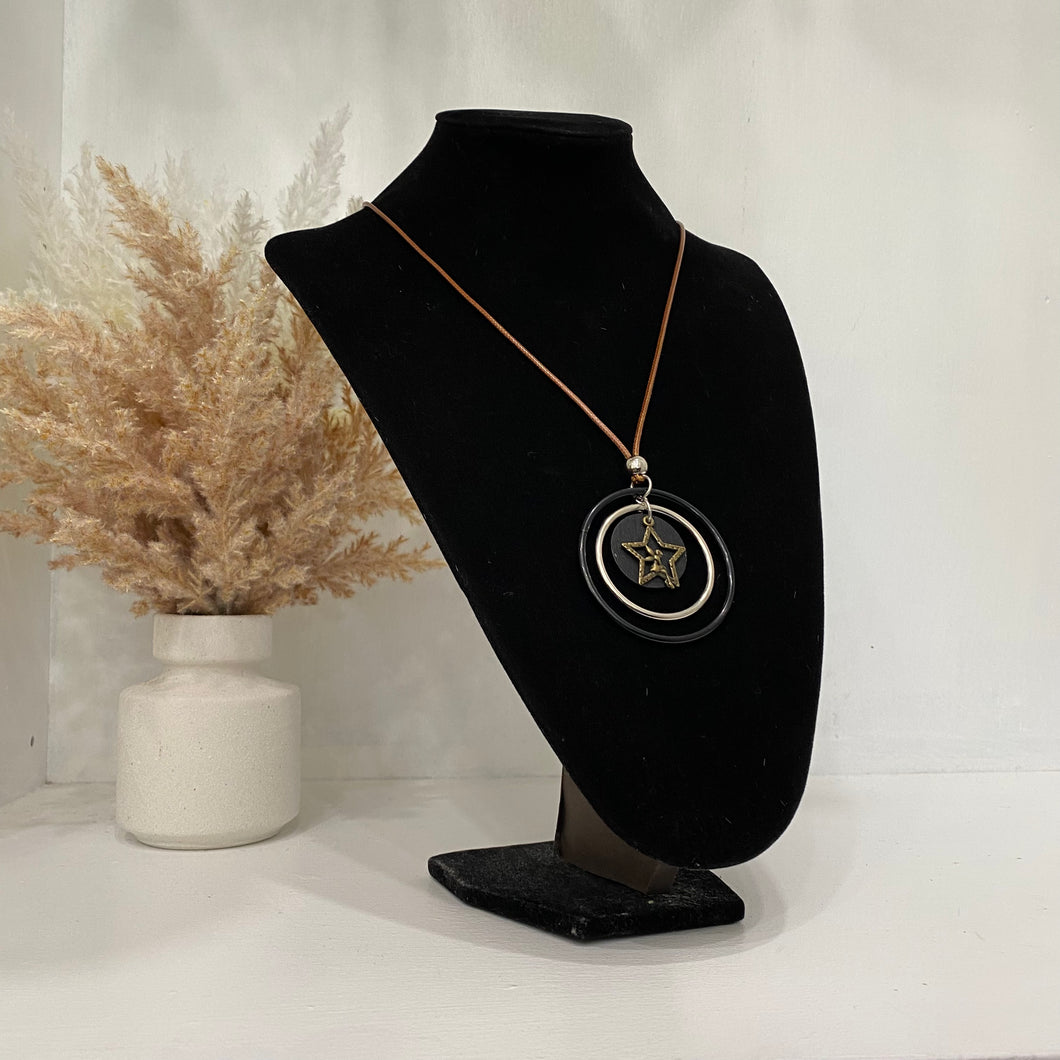 Coral Coloured Necklace With Multiple Circles And A Gold Star
