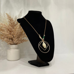 Off-White Necklace With A Shell Pendant