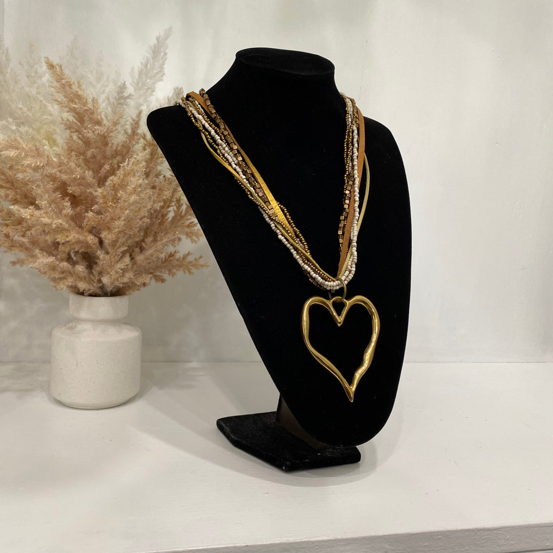 Multiple Layered Necklace With A Gold Heart