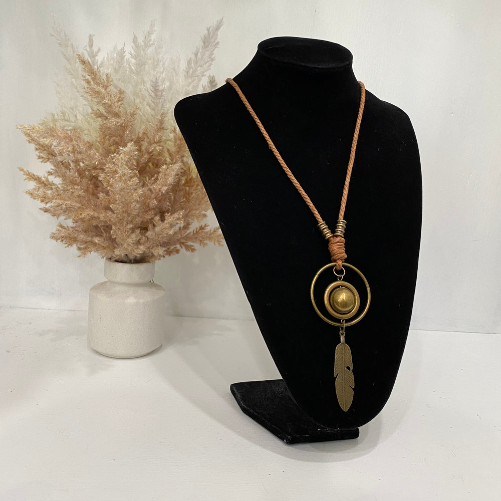 Coral Coloured Necklace With Circles And A Feather